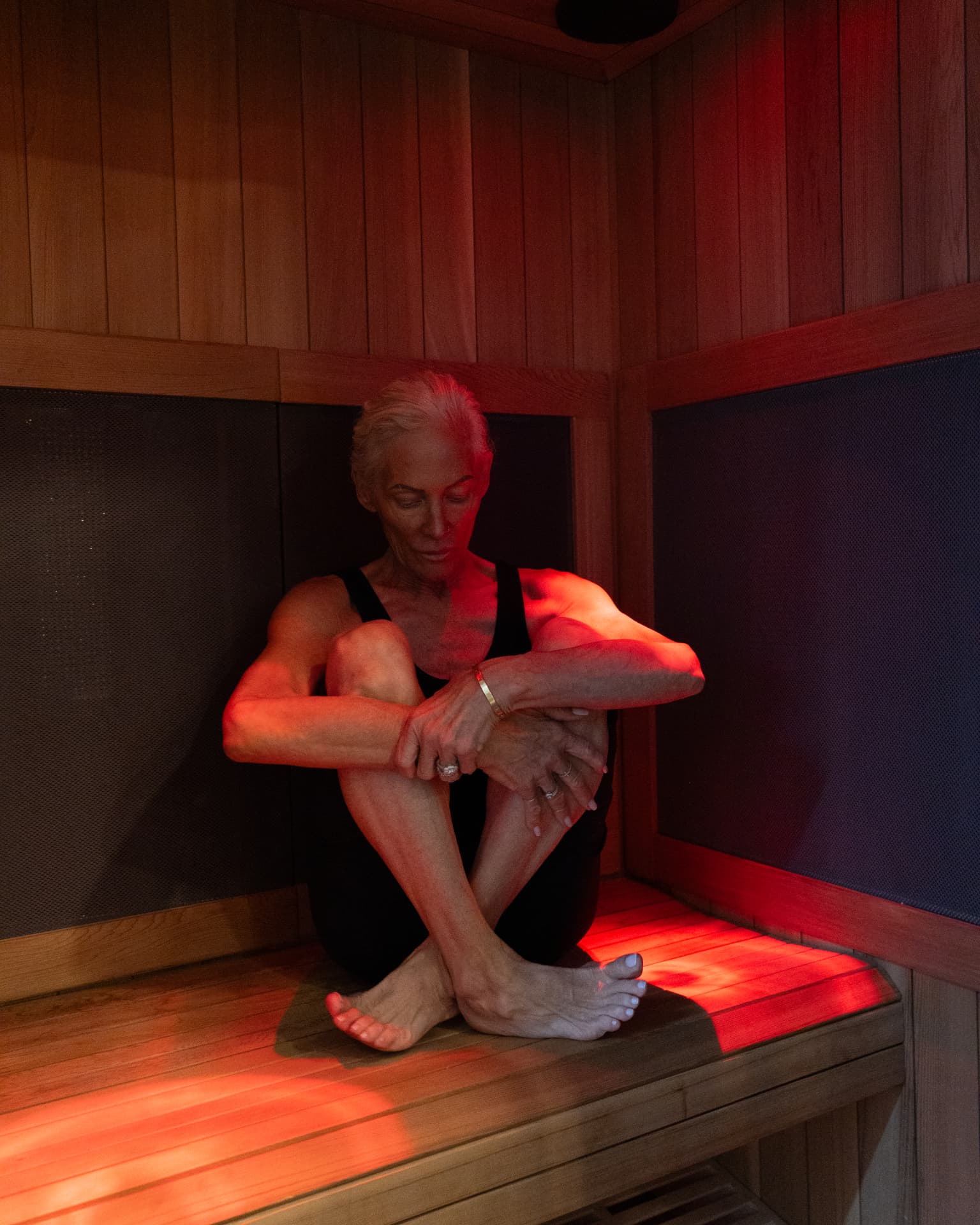 Member relaxing in API's traditional sauna in the Recovery Zone in Hailey, ID